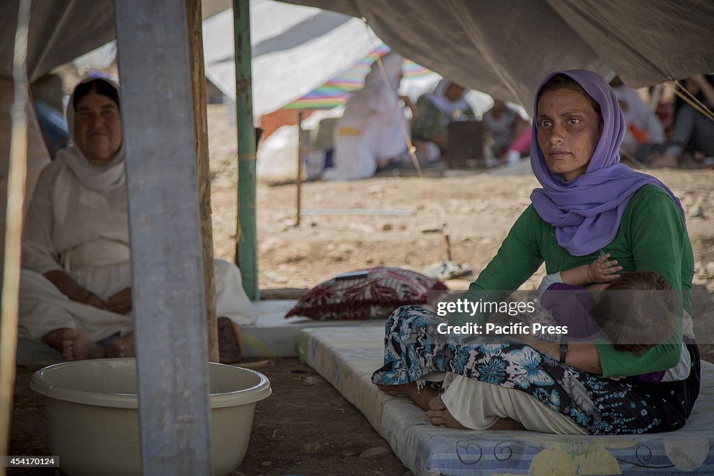 Yazidi refugees rest at Delal Refugee Camp in Zakho. The...