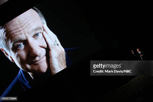 66th ANNUAL PRIMETIME EMMY AWARDS -- Pictured: An image of the late Robin Williams appears while actor/comedian Billy Crystal speaks on stage during...