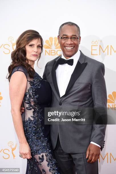 Actor Joe Morton and Christine Lietz pose in the press room during the 66th Annual Primetime Emmy Awards held at Nokia Theatre L.A. Live on August...