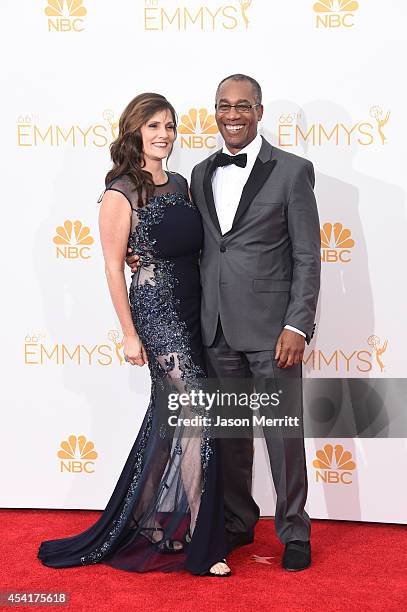 Actor Joe Morton and Christine Lietz pose in the press room during the 66th Annual Primetime Emmy Awards held at Nokia Theatre L.A. Live on August...