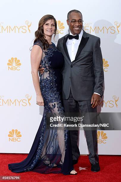 66th ANNUAL PRIMETIME EMMY AWARDS -- Pictured: Christine Lietz and actor Joe Morton pose in the press room during the 66th Annual Primetime Emmy...