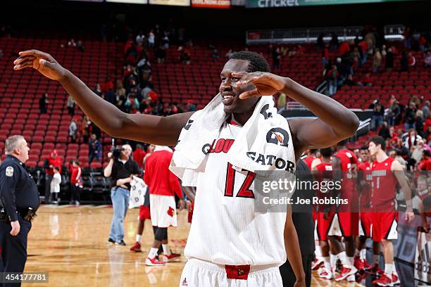 Mangok Mathiang of the Louisville Cardinals celebrates after the game against the Louisiana-Lafayette Ragin' Cajuns at KFC Yum! Center on December 7,...