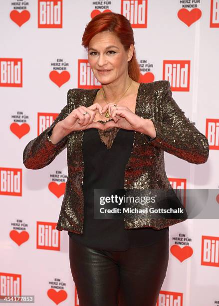 Singer Andrea Berg attends the Ein Herz Fuer Kinder Gala 2013 at Flughafen Tempelhof on December 7, 2013 in Berlin, Germany.