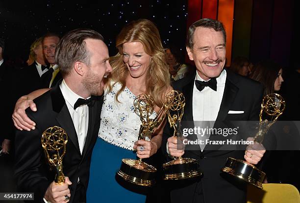 Actors Aaron Paul, Anna Gunn and Bryan Cranston attend the 66th Annual Primetime Emmy Awards Governors Ball held at Los Angeles Convention Center on...