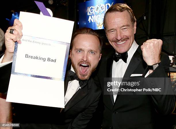 66th ANNUAL PRIMETIME EMMY AWARDS -- Pictured: Actors Aaron Paul and Bryan Cranston, winners of Outstanding Drama Series for "Breaking Bad", pose...