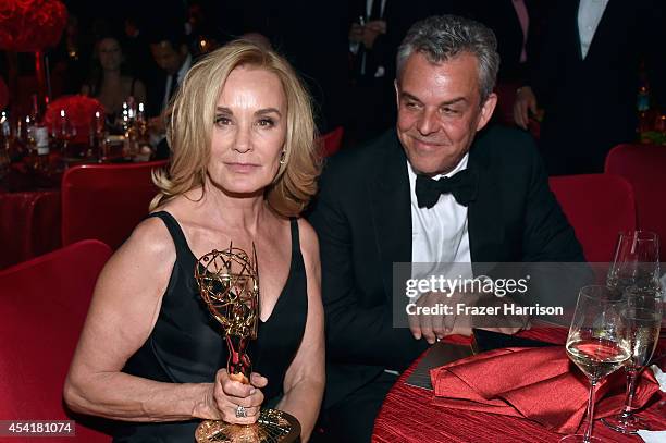 Actor Jessica Lange winner of the 'Outstanding lead in a miniseries or a movie' award for American Horror Story:Coven and actor John Huston attend...