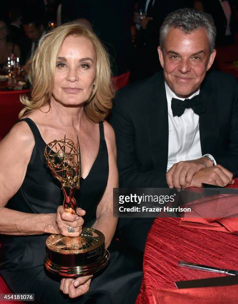 Actor Jessica Lange winner of the 'Outstanding lead in a miniseries or a movie' award for American Horror Story:Coven and actor John Huston attend...