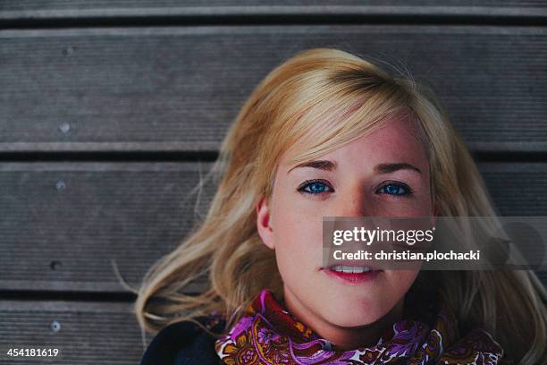 Portrait Of Beautiful Woman Lying On Woodpanels, Foto de stock