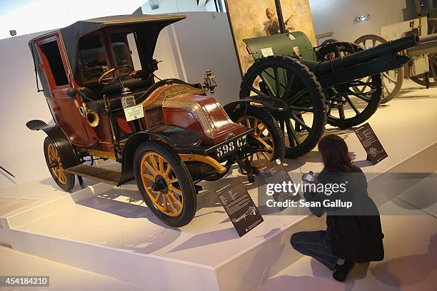 Vsitor looks at a Renault taxi like those used to transport 6,000 French soldiers from Paris to the front in the First Battle of the Marne during...