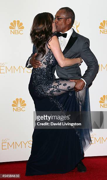 Actor Joe Morton and Christine Lietz pose in the press room at the 66th Annual Primetime Emmy Awards at the Nokia Theatre L.A. Live on August 25,...