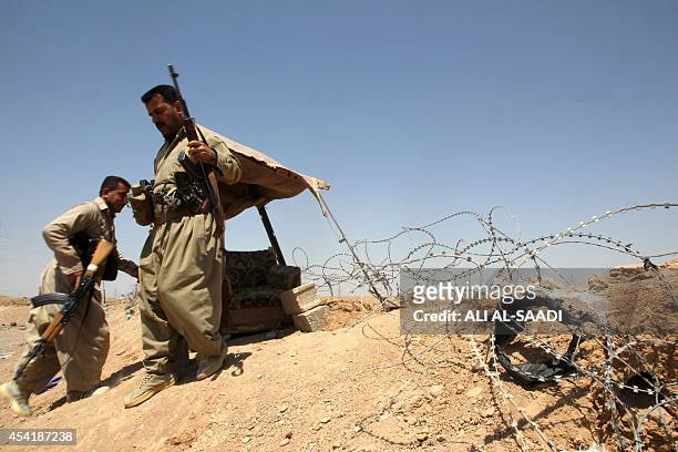 Peshmerga fighters take position at a post in the strategic Jalawla area, in Diyala province, which is a gateway to Baghdad, as battles with Islamic...