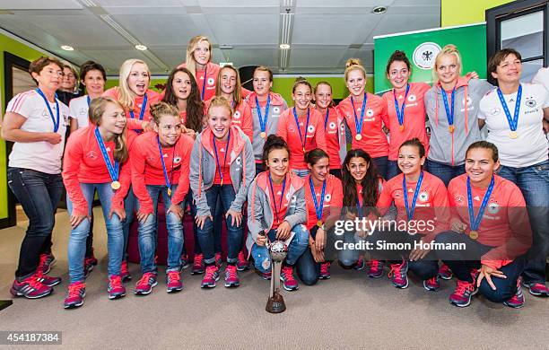 The team poses during the Germany U20 Women's Welcome Home Reception As World Champions at Frankfurt International Airport on August 26, 2014 in...
