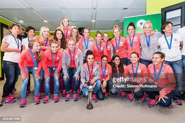 The team poses during the Germany U20 Women's Welcome Home Reception As World Champions at Frankfurt International Airport on August 26, 2014 in...