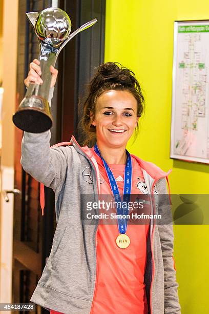 Lina Magull celebrates during the Germany U20 Women's Welcome Home Reception As World Champions at Frankfurt International Airport on August 26, 2014...