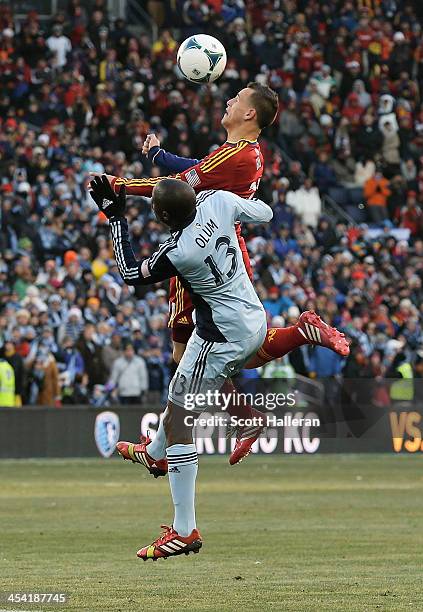 Lawrence Olum of Sporting KC batlles for the ball against Luis Gil of Real Salt Lake in the first half of the 2013 MLS Cup at Sporting Park on...