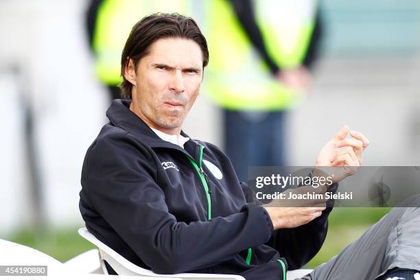 Coach Thomas Brdaric of Wolfsburg challenges # of Hamburg during the third league match between VfL Wolfsburg II and Hamburger SV II at VfL Stadion...