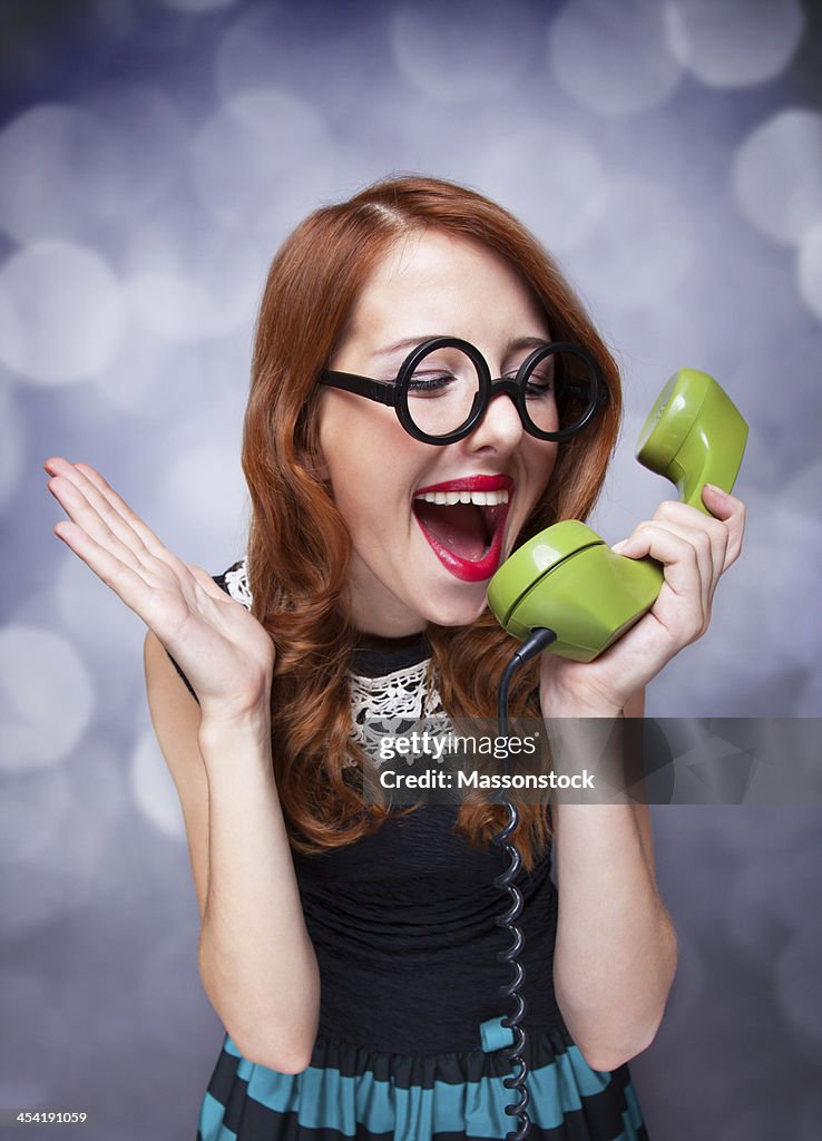 Women with green telephone