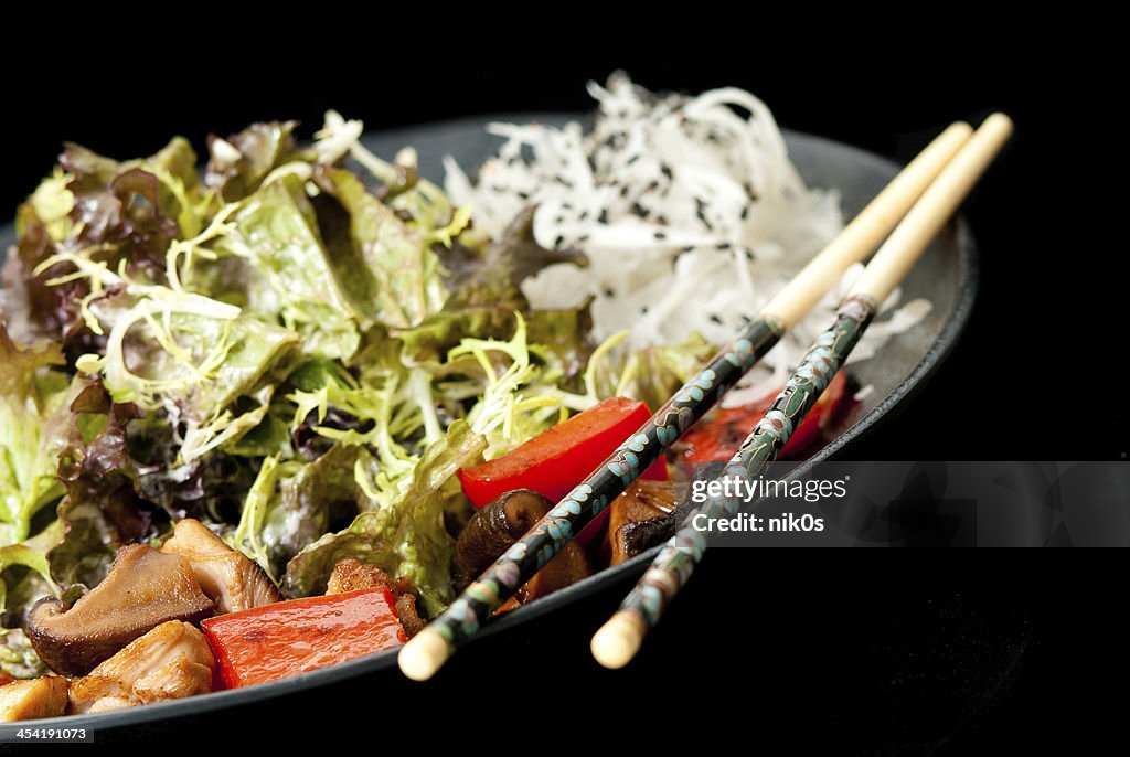 Healthy Japanese salad on the black plate