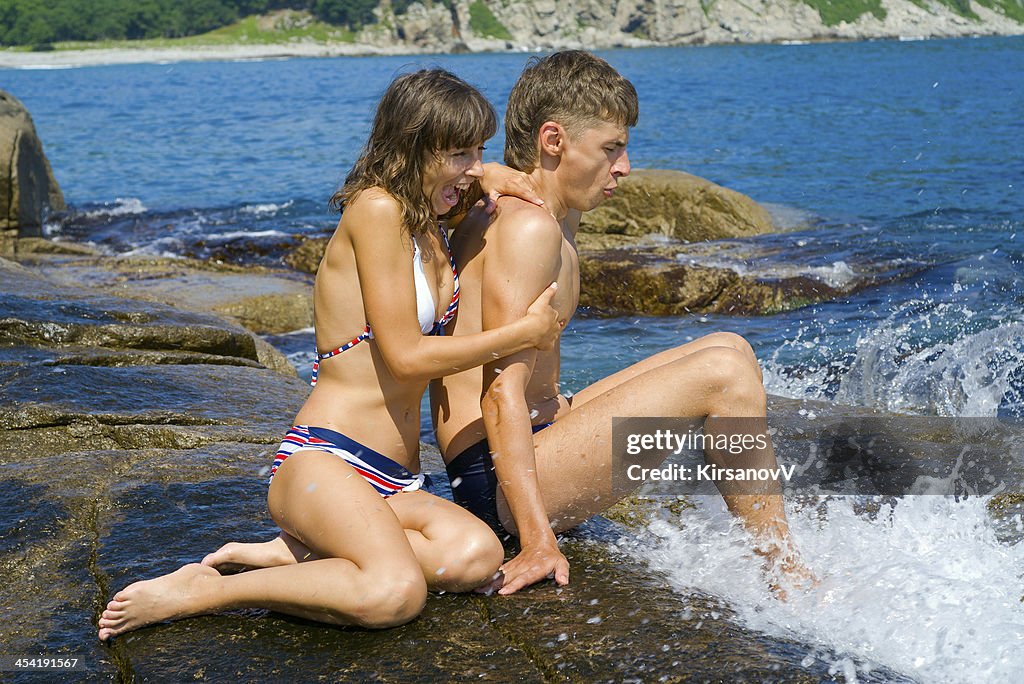 Young man and woman at surf