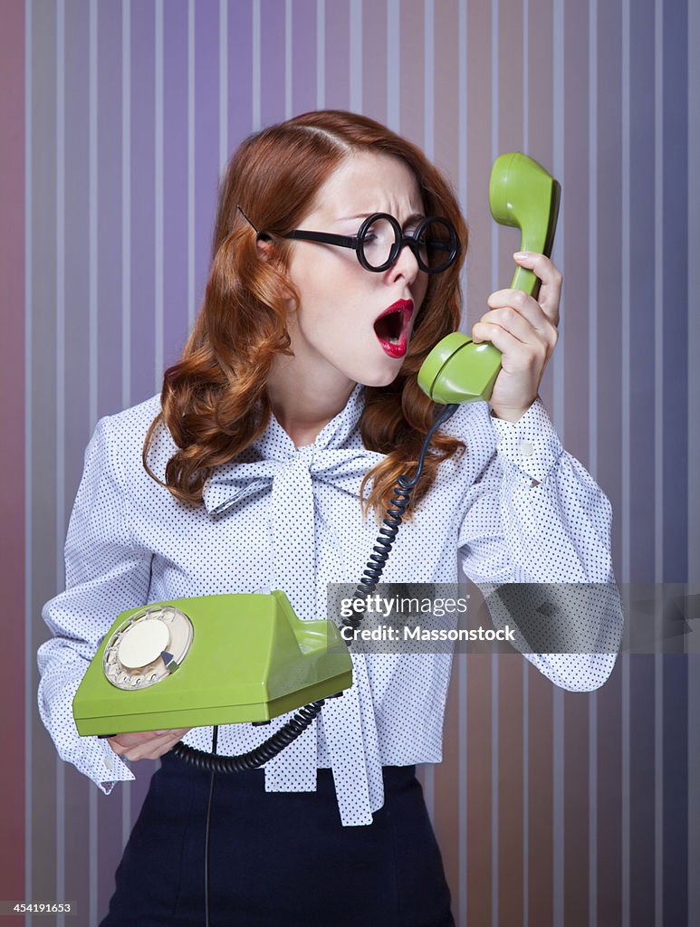 Women with green telephone