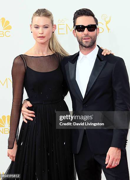 Model Behati Prinsloo and husband singer Adam Levine attend the 66th Annual Primetime Emmy Awards at the Nokia Theatre L.A. Live on August 25, 2014...