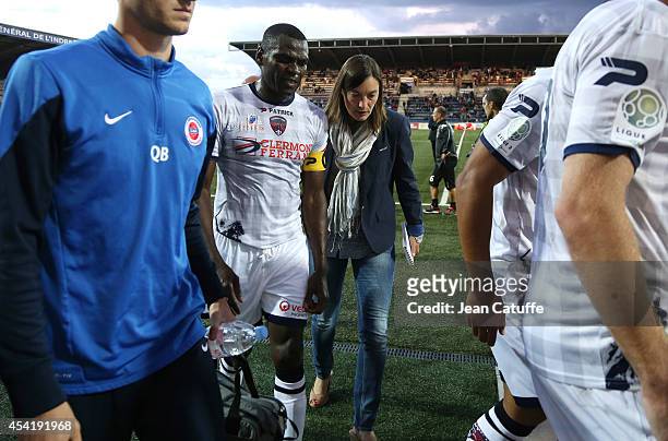 Corinne Diacre, first woman's coach in French professional football, at Clermont Foot Auvergne talks to her captain Eugene Ekobo at half time of the...