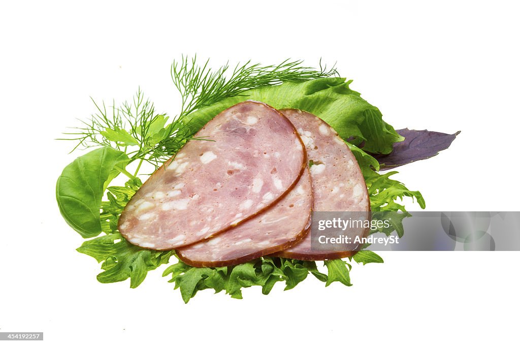 Sausages with salad and basil