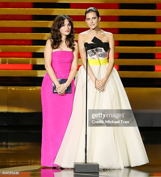 Zooey Deschanel and Allison Williams speak onstage during the 66th Annual Primetime Emmy Awards held at Nokia Theatre L.A. Live on August 25, 2014 in...