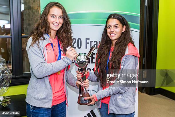 Sara Daebritz and Manjou Wilde pose during the Germany U20 Women's Welcome Home Reception As World Champions at Frankfurt International Airport on...