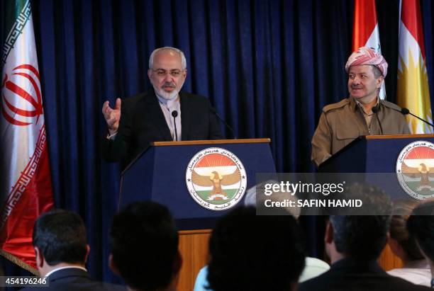 Iranian Foreign Minister Mohammad Javad Zarif and Iraqi Kurdish leader Massud Barzani give a joint press conference following their meeting in Arbil,...