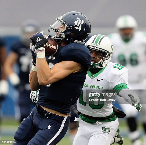 Jordan Taylor of the Rice Owls catches a pass for a 75 yard touchdown as he gets behind Corey Tindal of the Marshall Thundering Herd at Rice Stadium...