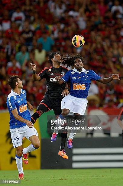 Luis Antonio of Flamengo fights for the ball with Tinga and Leandro Guerreiro of Cruzeiro during the match between Flamengo and Cruzeiro for the...