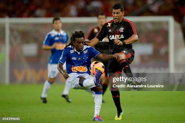 Andre Santos of Flamengo fights for the ball with Tinga of Cruzeiro during the match between Flamengo and Cruzeiro for the Brazilian Series A 2013 at...