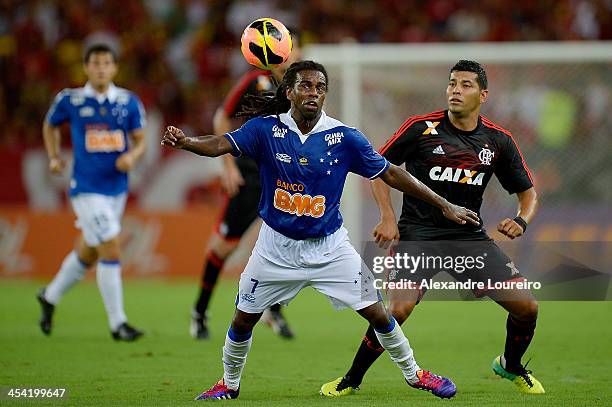 Andre Santos of Flamengo fights for the ball with Tinga of Cruzeiro during the match between Flamengo and Cruzeiro for the Brazilian Series A 2013 at...