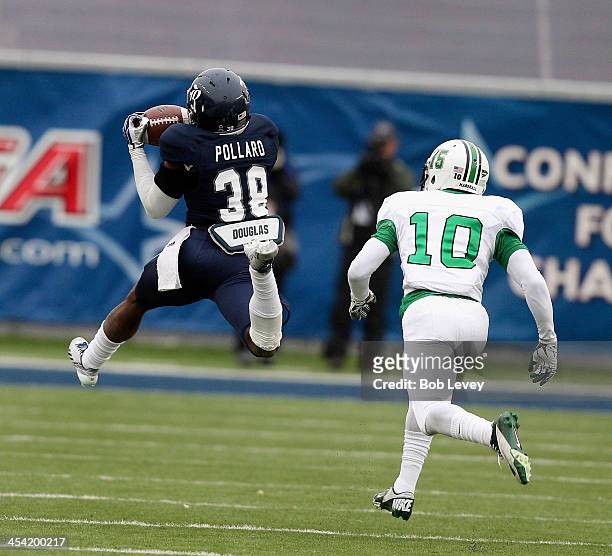 Darrion Pollard of the Rice Owls catches a pass for a 28 yard gain as he gets behind Corey Tindal of the Marshall Thundering Herd at Rice Stadium on...