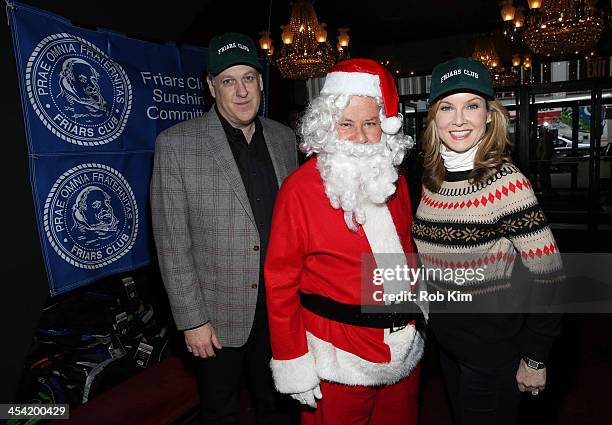 Michael Kay, Marvin Scott and Jodi Applegate attend the "Cloudy With A Chance of Meatballs 2" Holiday Screening hosted by The Friar's Club at...
