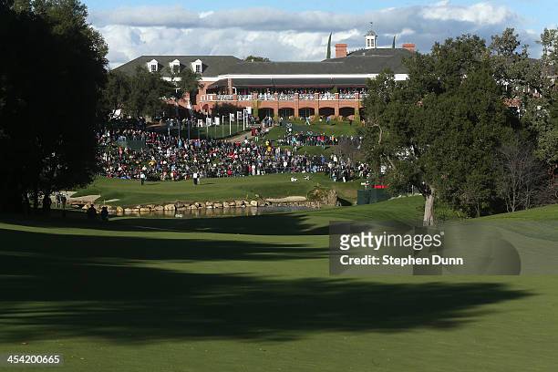 Pairing plays on the 18th green during the third round of the Northwestern Mutual World Challenge at Sherwood Country Club on December 7, 2013 in...