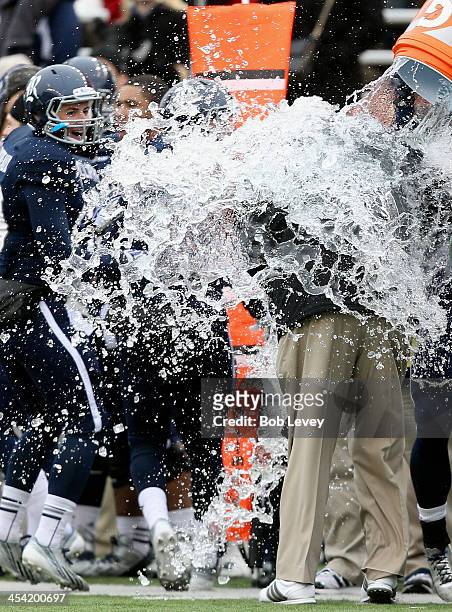 David Bailff, head coach of the Rice Owls , is doused in a wall of water as the Rice Owls defeated the Marshall Thundering Herd to win the Conference...