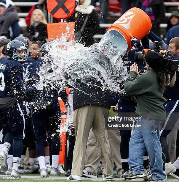 David Bailff, head coach of the Rice Owls , is doused in a wall of water as the Rice Owls defeated the Marshall Thundering Herd to win the Conference...