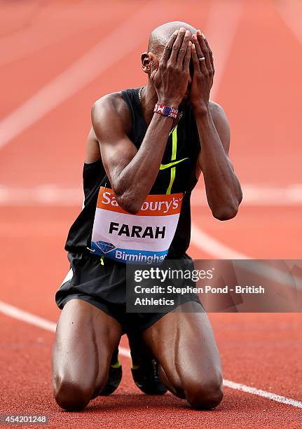 Mo Farah of Great Britain celebrates winning the Men's 2 Mile event with a new british record during the Sainsbury's Birmingham Grand Prix Diamond...