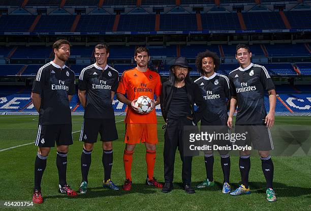 Iker Casillas of Real Madrid CF and teammates James Rodriguez, Xabi Alonso, Gareth Bale, and Marcelo of Real Madrid with designer Yohji Yamamoto...