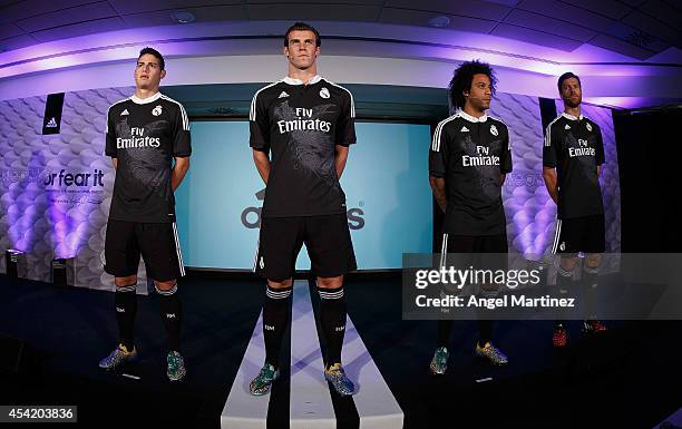 James Rodriguez, Gareth Bale, Marcelo Vieira and Xabi Alonso of Real Madrid during the Adidas 3rd kit launch at Estadio Santiago Bernabeu on August...