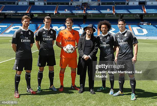 Xabi Alonso, Gareth Bale, Iker Casillas, Marcelo Vieira and James Rodriguez of Real Madrid pose with designer Yohji Yamamoto during the adidas 3rd...