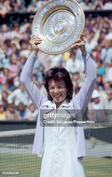 Billie Jean King of the United States with the trophy after winning the Ladies' Singles Final at Wimbledon, defeating Chris Evert in straight sets,...