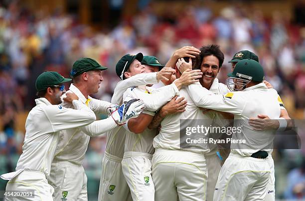 Mitchell Johnson of Australia celebrates celebrates after taking the wicket of Alastair Cook of England during day four of the Second Ashes Test...