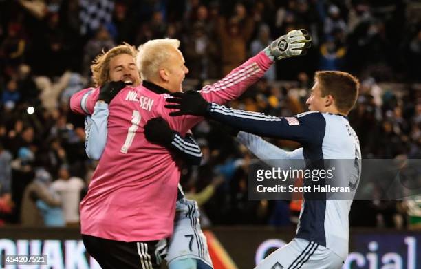 Jimmy Nielsen of Sporting KC celebrates with his teammates Chance Myers and Matt Besler after defeating Real Salt Lake in penalty kicks to win the...