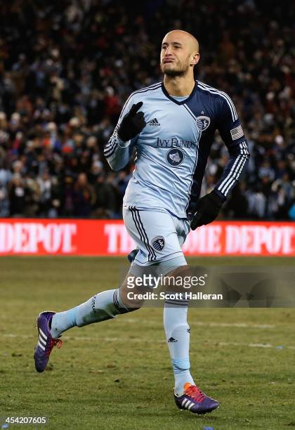 Aurelien Collin of Sporting KC reacts to scoring during the shootout against Real Salt Lake during the 2013 MLS Cup at Sporting Park on December 7,...