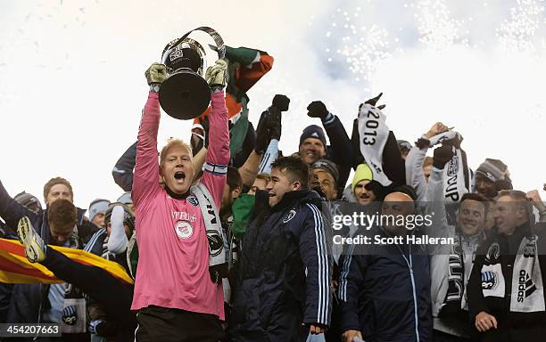 Jimmy Nielsen of Sporting KC celebrates with the Philip F. Anschutz trophy and his teammates after defeating Real Salt Lake in penalty kicks to win...