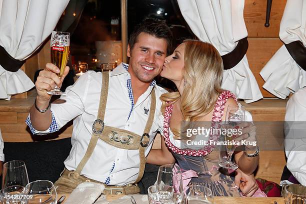 Thore Schoelermann and Jana Julie Kilka attend the Dorfstadl Evening - Tirol Cross Mountain 2013 on December 07, 2013 in Innsbruck, Austria.