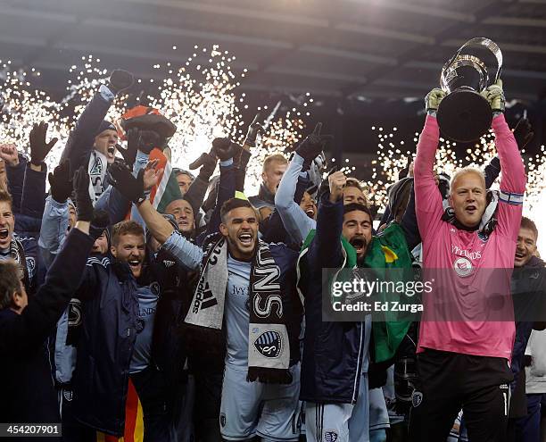 Jimmy Nielsen of Sporting Kansas City celebrate with the trophy and teammates after winning the MLS Cup Final against the Real Salt Lake at Sporting...